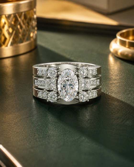The Embrace — an elongated oval diamond engagement ring with its custom diamond wrap